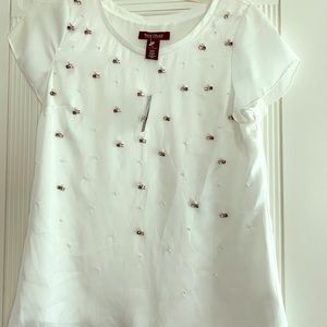 White with pearl embellished blouse.